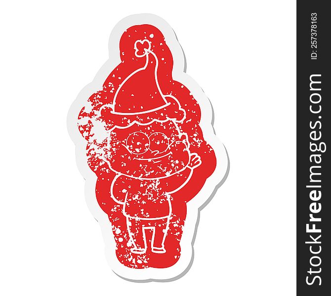 Cartoon Distressed Sticker Of A Bald Man Staring Wearing Santa Hat