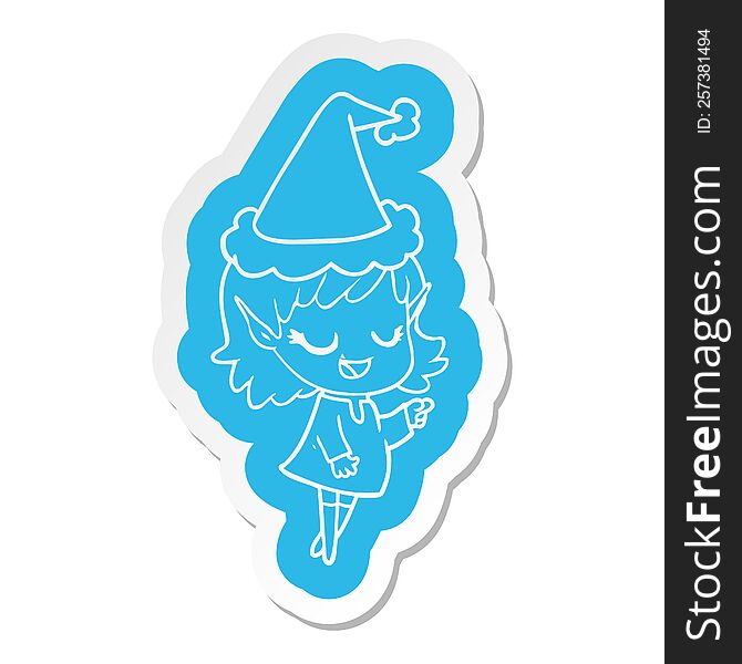 happy quirky cartoon  sticker of a elf girl pointing wearing santa hat