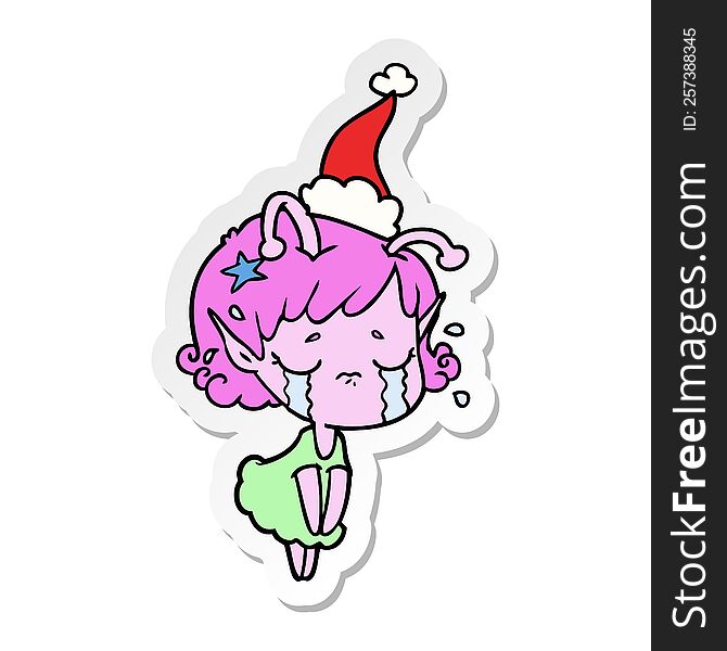 Sticker Cartoon Of A Crying Alien Girl Wearing Santa Hat