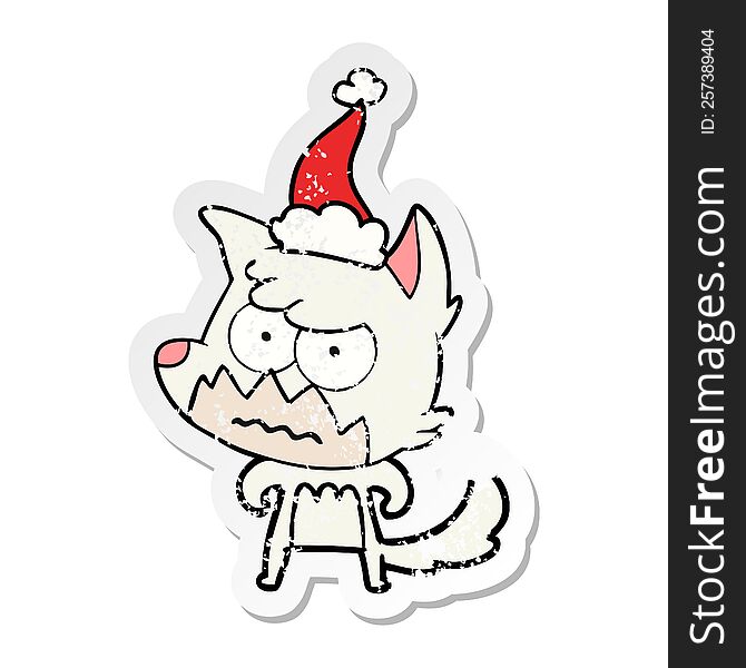 Distressed Sticker Cartoon Of A Annoyed Fox Wearing Santa Hat