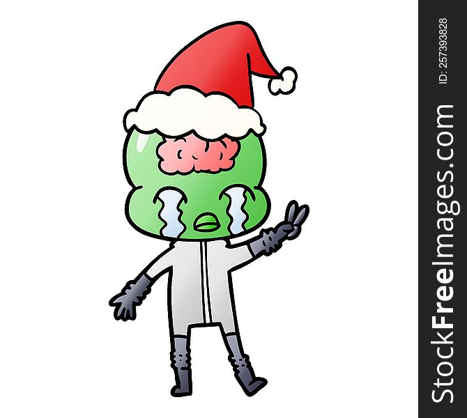 hand drawn gradient cartoon of a big brain alien crying and giving peace sign wearing santa hat