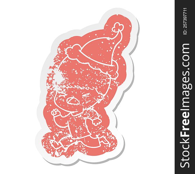 Cartoon Distressed Sticker Of A Stressed Man Wearing Santa Hat