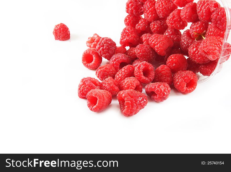 Raspberries is scattered from a plastic bag