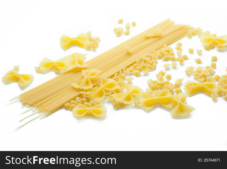 Sorts of macaroni products isolated on white. Sorts of macaroni products isolated on white.