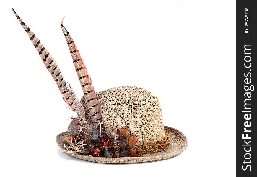 A hunting hat with pheasant feathers on white