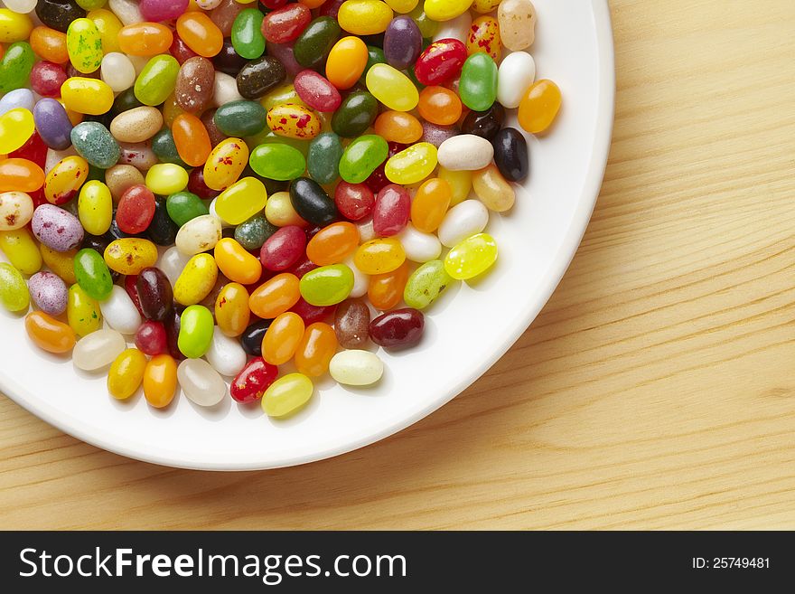 Colourful jelly beans in bowl on table