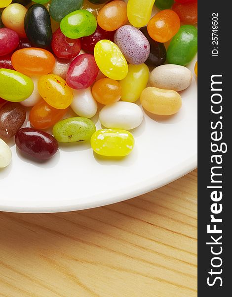 Colourful jelly beans in bowl on table