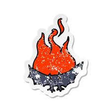 Retro Distressed Sticker Of A Cartoon Flaming Halloween Bat Stock Photo