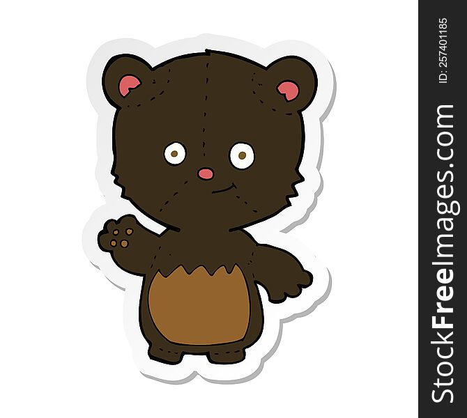 sticker of a cartoon little black bear waving