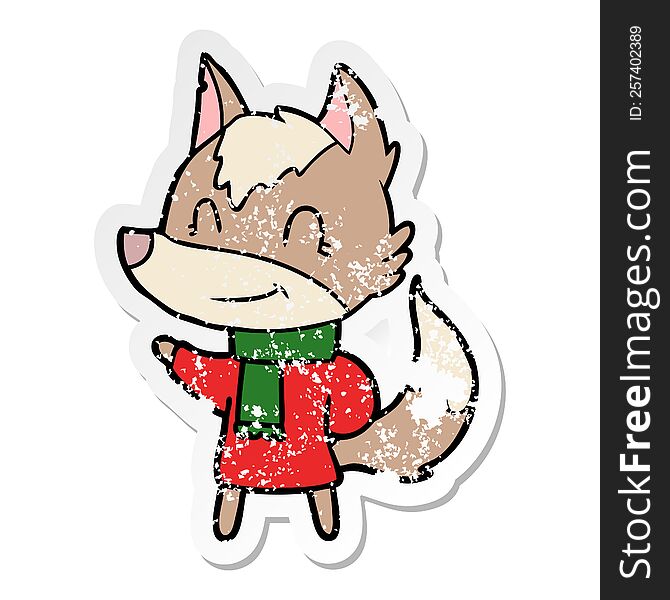 distressed sticker of a friendly cartoon wolf in winter clothes