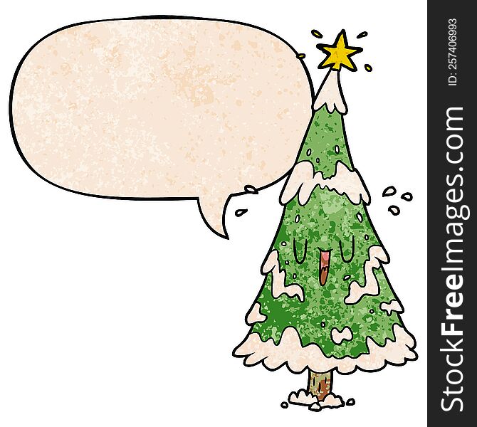 cartoon snowy christmas tree with happy face with speech bubble in retro texture style. cartoon snowy christmas tree with happy face with speech bubble in retro texture style