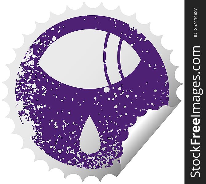 distressed circular peeling sticker symbol of a crying eye looking to one side