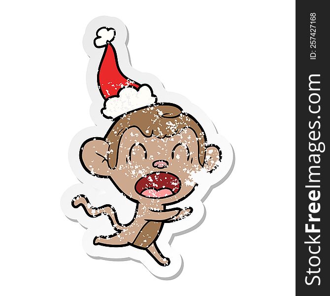 shouting hand drawn distressed sticker cartoon of a monkey wearing santa hat