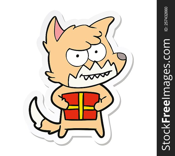 sticker of a cartoon grinning fox with present