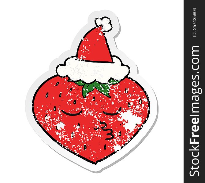 hand drawn distressed sticker cartoon of a strawberry wearing santa hat