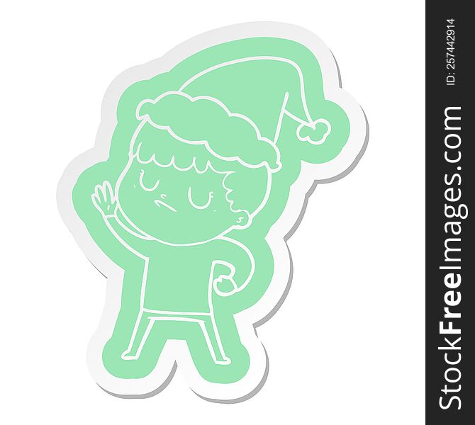 quirky cartoon  sticker of a grumpy boy wearing santa hat
