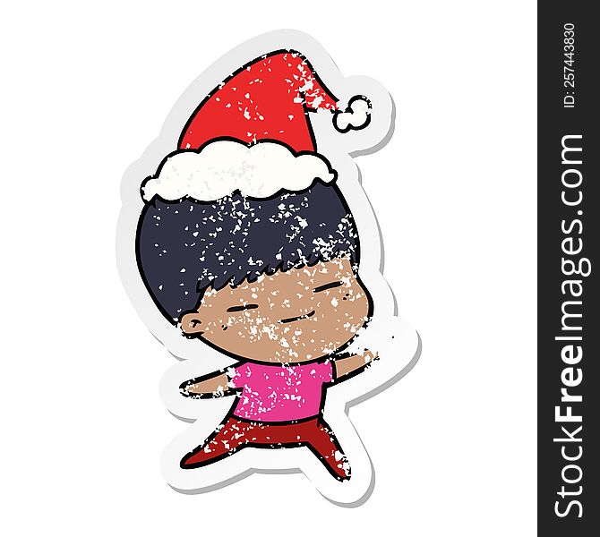 Distressed Sticker Cartoon Of A Smug Boy Wearing Santa Hat