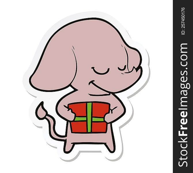 Sticker Of A Cartoon Smiling Elephant With Present