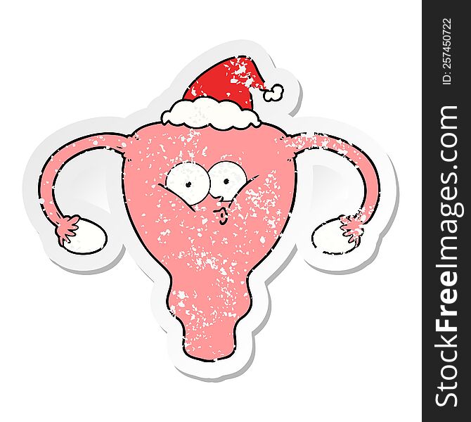 Distressed Sticker Cartoon Of A Uterus Wearing Santa Hat