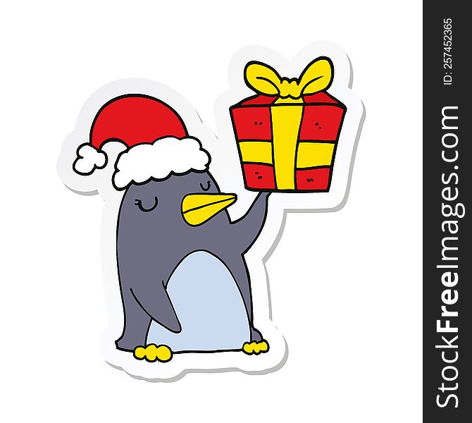 sticker of a cartoon penguin with christmas present