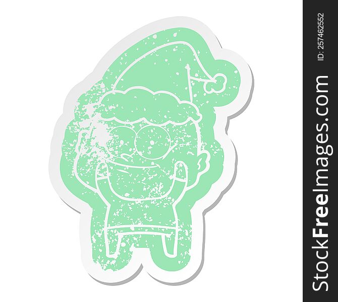 Cartoon Distressed Sticker Of A Bald Man Staring Wearing Santa Hat