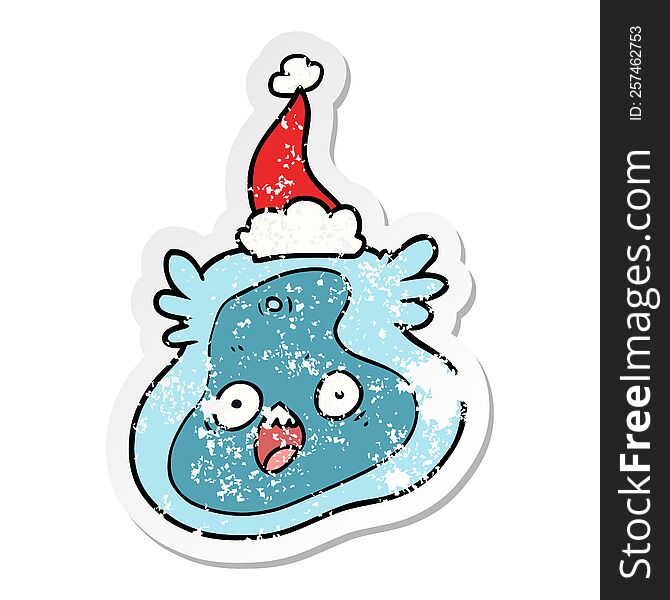 hand drawn distressed sticker cartoon of a germ wearing santa hat