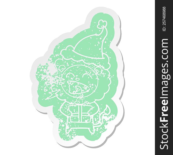 quirky cartoon distressed sticker of a roaring lion with gift wearing santa hat