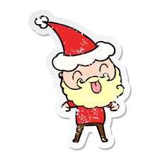Man With Beard Sticking Out Tongue Wearing Santa Hat Stock Image