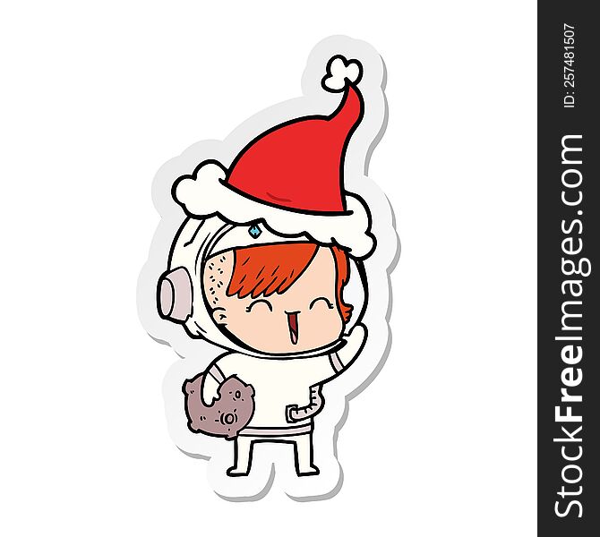 hand drawn sticker cartoon of a happy spacegirl holding moon rock wearing santa hat