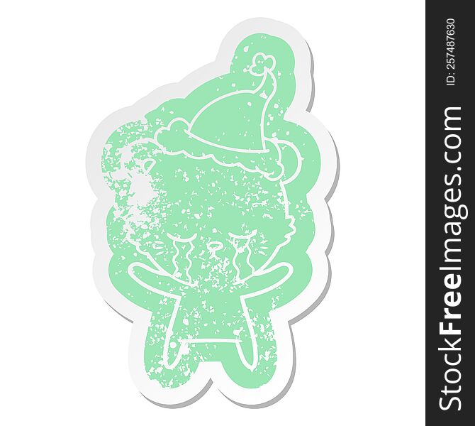 Crying Cartoon Distressed Sticker Of A Polarbear Wearing Santa Hat