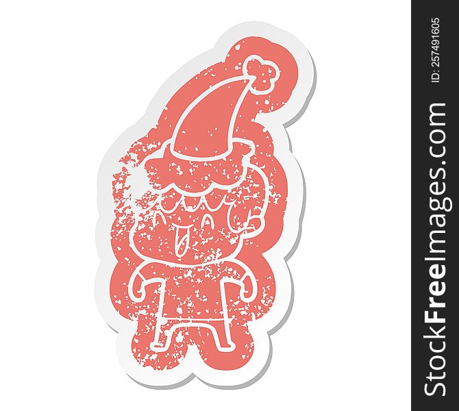 quirky cartoon distressed sticker of a laughing boy wearing santa hat