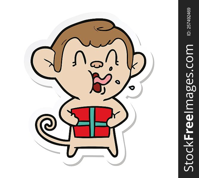 Sticker Of A Crazy Cartoon Monkey With Christmas Present