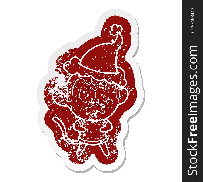 Cartoon Distressed Sticker Of A Surprised Monkey Wearing Santa Hat