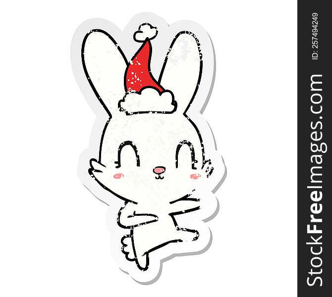Cute Distressed Sticker Cartoon Of A Rabbit Dancing Wearing Santa Hat
