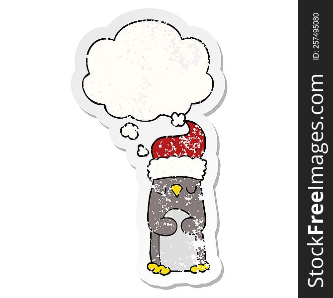 Cartoon Christmas Penguin And Thought Bubble As A Distressed Worn Sticker