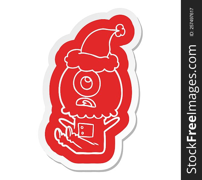 Cartoon  Sticker Of A Cyclops Alien Spaceman Wearing Santa Hat