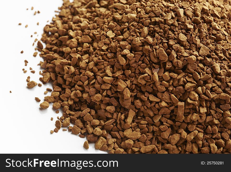 Instant coffee granules on white plate