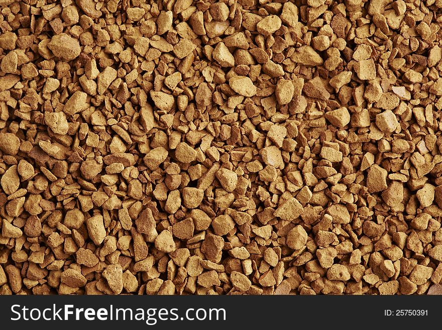 Instant coffee granules on white plate