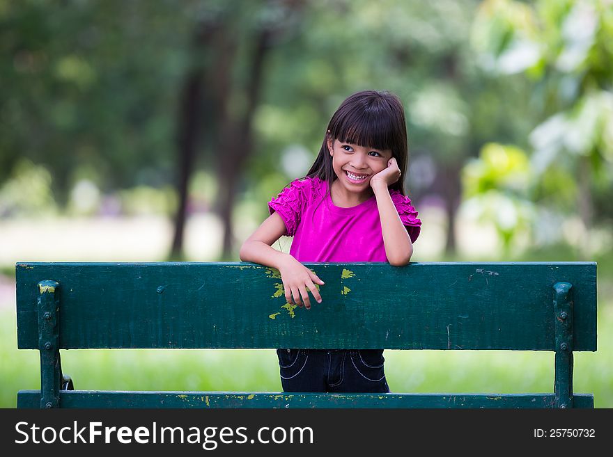 Smiling little girl at park, Outdoor portrait
