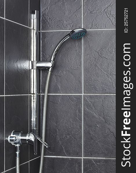 Shower in contemporary grey tiled bathroom. Shower in contemporary grey tiled bathroom