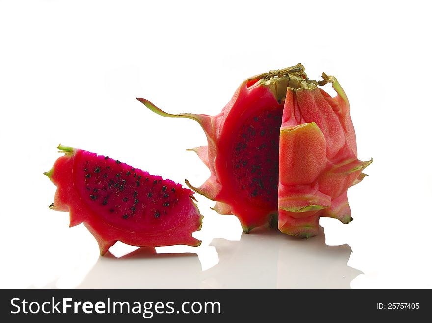 Vivid and vibrant red dragon fruit isolated on white. Vivid and vibrant red dragon fruit isolated on white