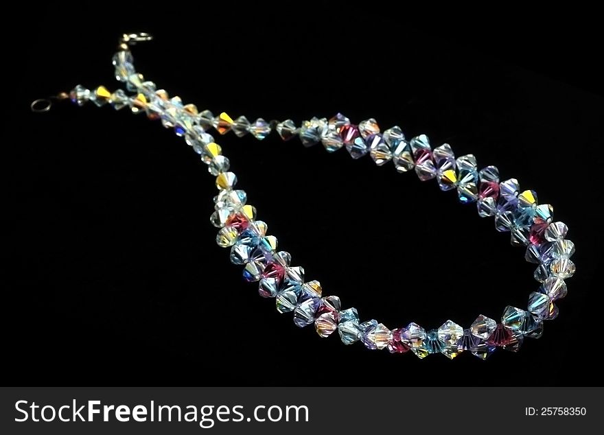 Crystal beads necklace over black background. Crystal beads necklace over black background
