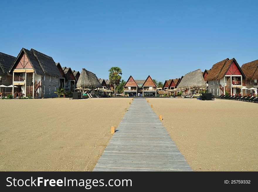 Chalet accomodation on a beach at a tropical resort. Chalet accomodation on a beach at a tropical resort