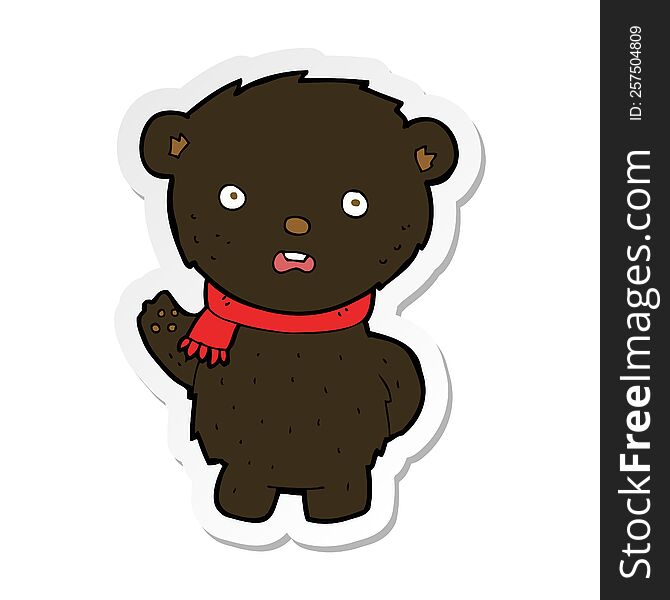 sticker of a cartoon black bear wearing scarf