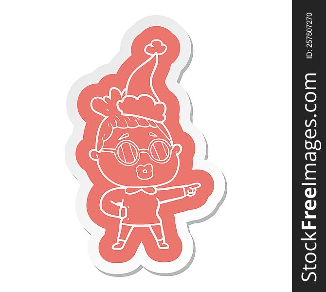 quirky cartoon  sticker of a pointing woman wearing spectacles wearing santa hat