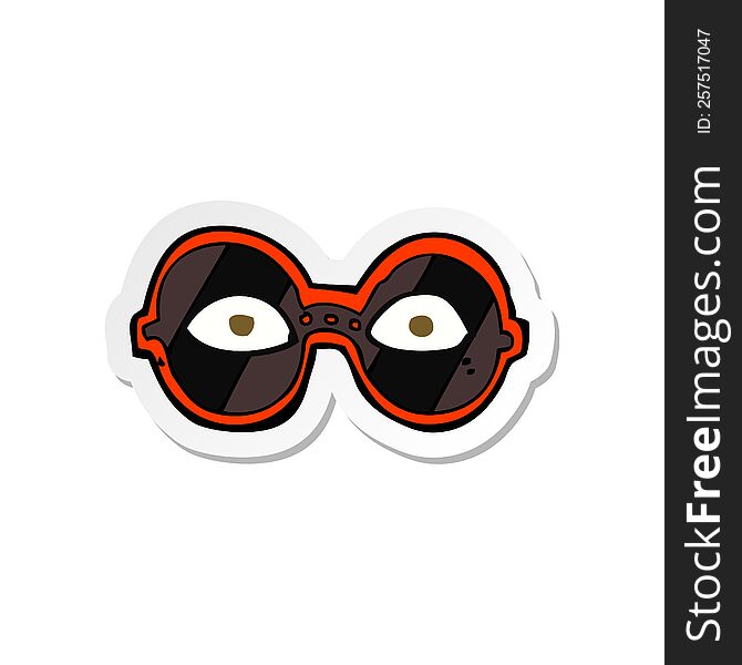 sticker of a cartoon eyes in dark glasses