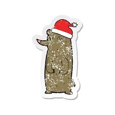 Retro Distressed Sticker Of A Cartoon Bear In Xmas Hat Royalty Free Stock Photo