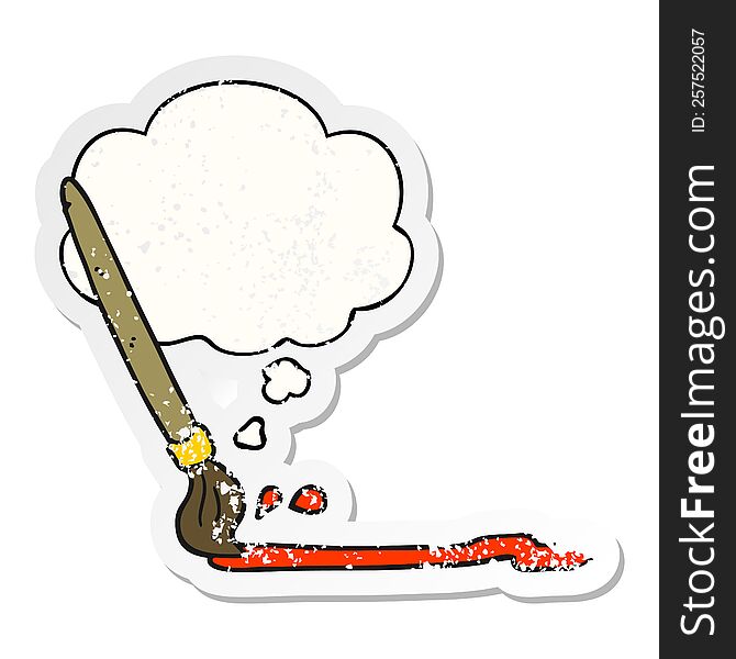 cartoon paintbrush with thought bubble as a distressed worn sticker