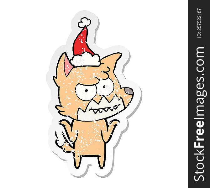 hand drawn distressed sticker cartoon of a grinning fox wearing santa hat