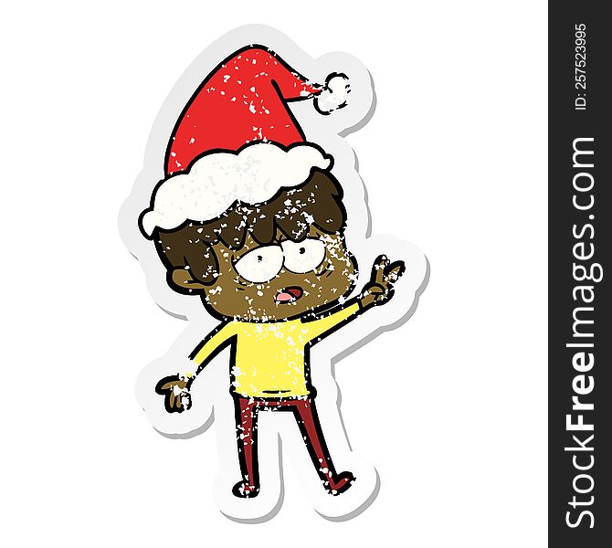 hand drawn distressed sticker cartoon of a exhausted boy wearing santa hat